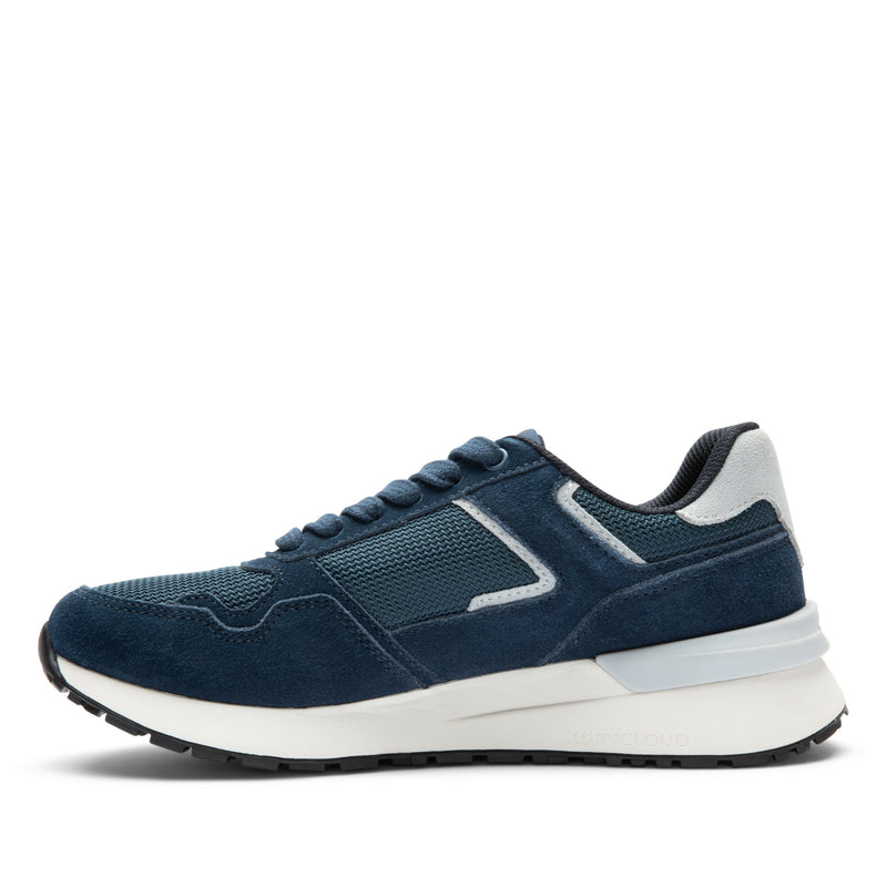 Inner side view of the KURU APOGEE Unisex Sneaker in Indigo-Bright White.