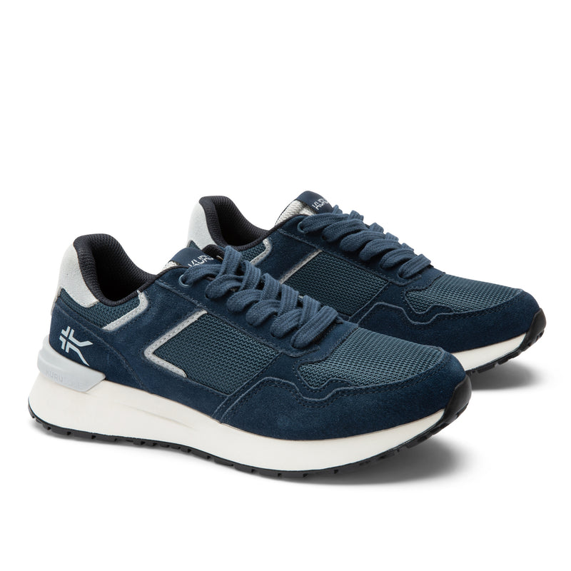 Pair of KURU APOGEE Unisex Sneaker in Indigo-Bright White, angled view.