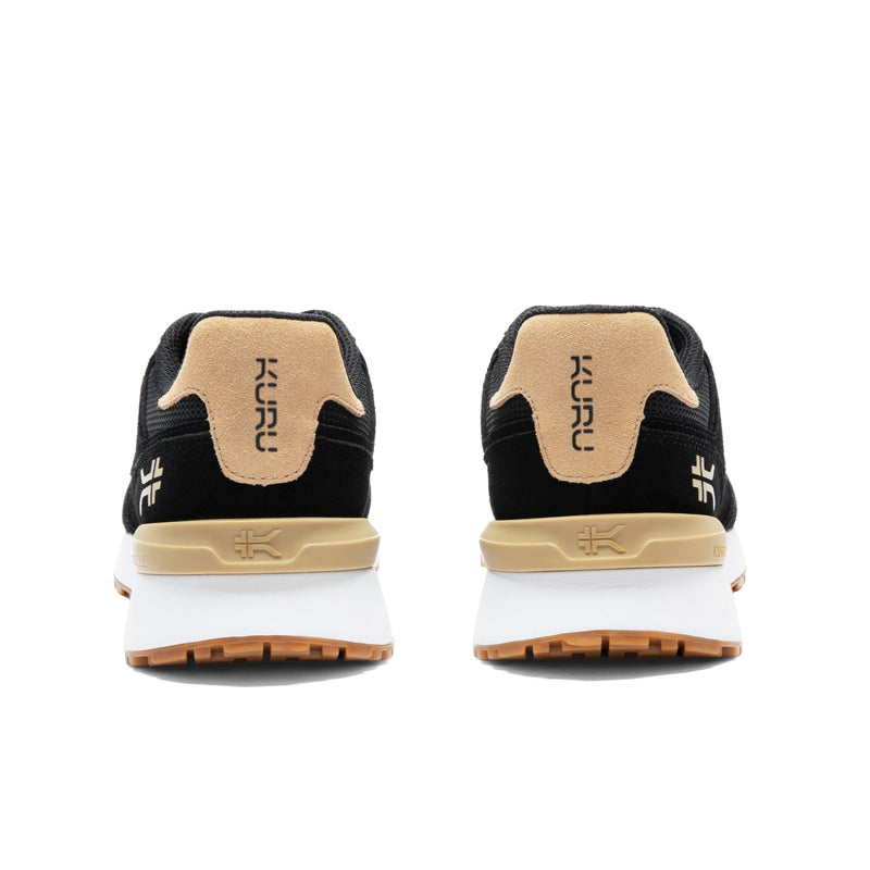 Back heel view of the KURU APOGEE Unisex Sneaker in Jet Black-Buff Tan.