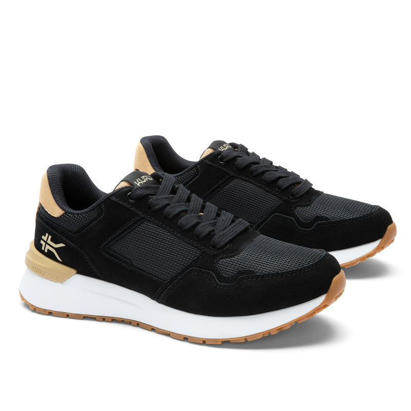 Pair of KURU APOGEE Unisex Sneaker in Jet Black-Buff Tan, angled view.