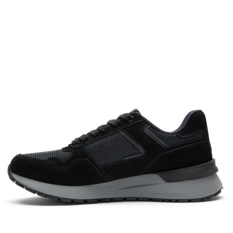 Inner side view of the KURU APOGEE Unisex Sneaker in Jet Black-Storm Gray.