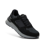 Angled profile view of the KURU APOGEE Unisex Sneaker in Jet Black-Storm Gray.