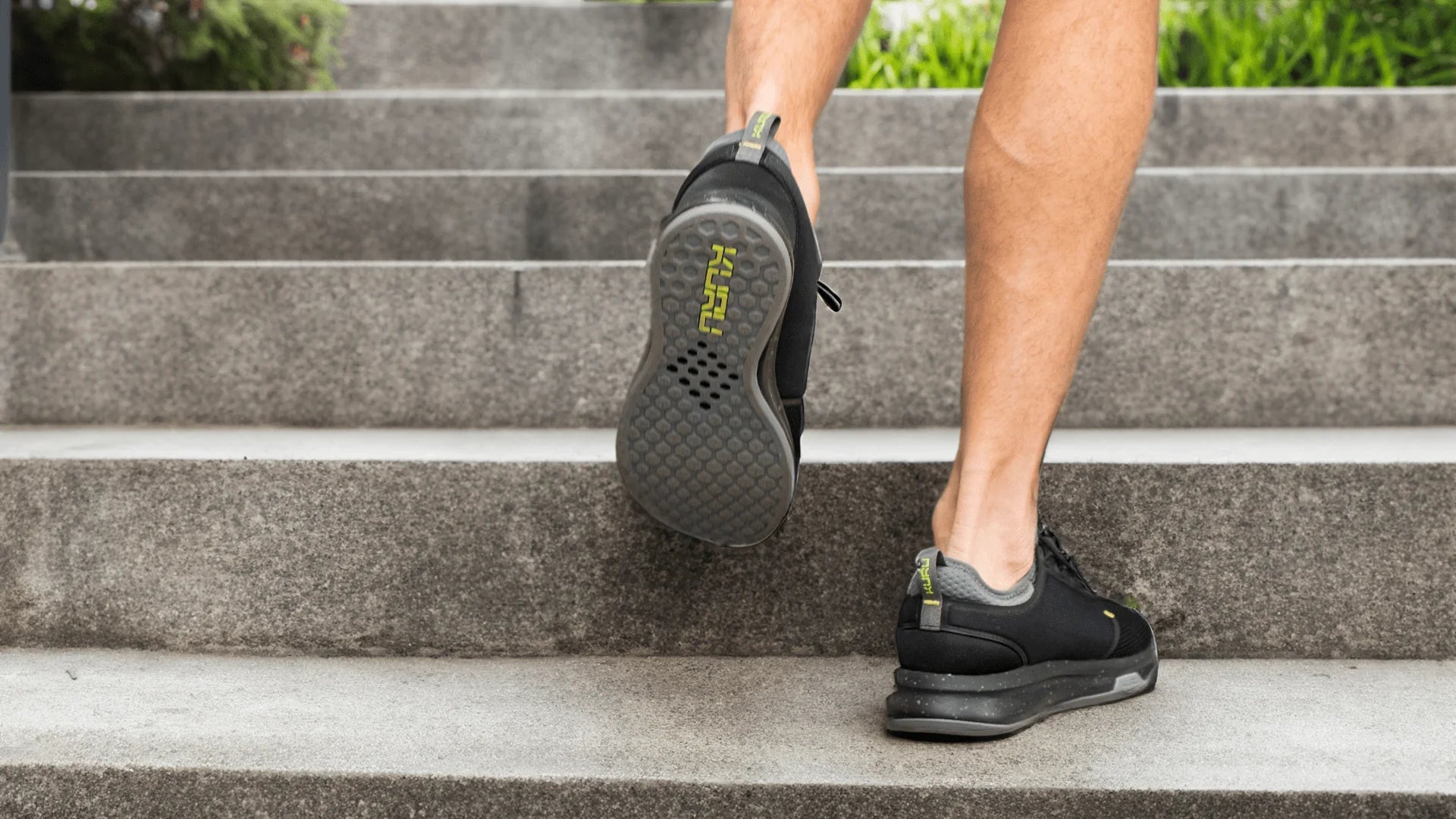 KURU ATOM shoes in Jet Black and Citron styled on stairs, featured in Valentine's Day gift guide.