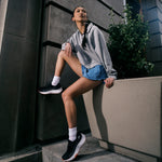 Angled profile view of the KURU ATOM 2 Slip-On Women's Slip-On Sneaker in Jet Black-Dark Coral.