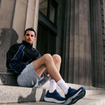 Back heel view of the KURU ATOM 2 Slip-On Men's Slip-On Sneaker in Mountain Blue-Dove Gray.