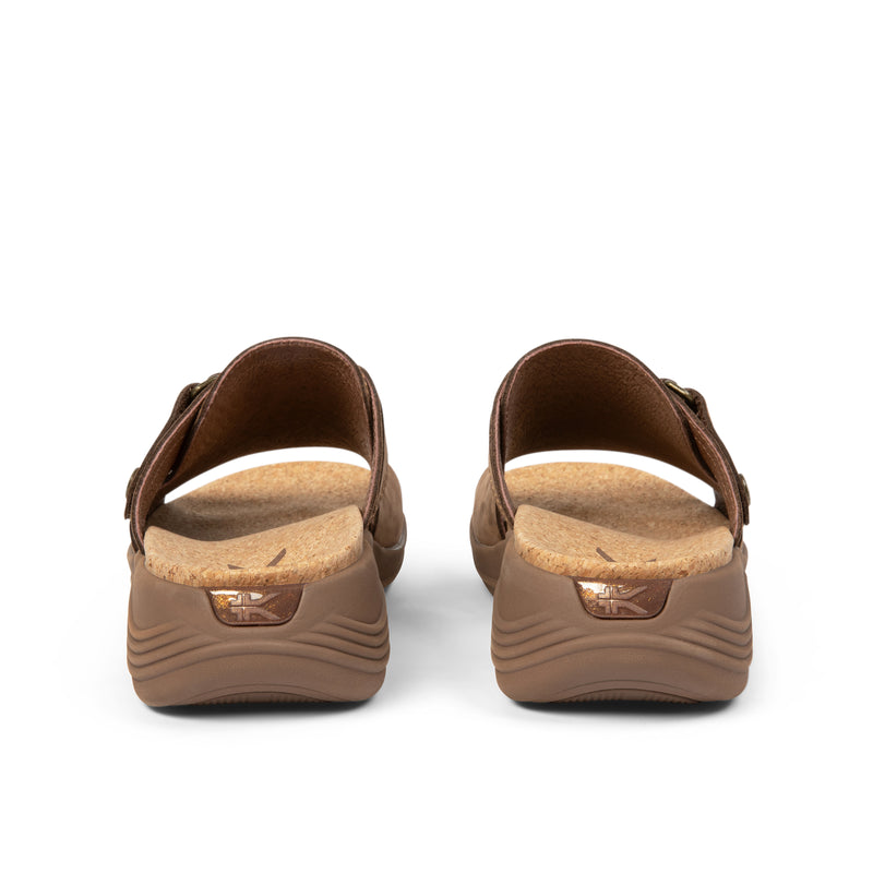 Back heel view of the KURU CODA Aika Women's Sandal in Molasses Brown.