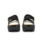 Back heel view of the KURU CODA Muse Women's Sandal in Jet Black-Emboss.