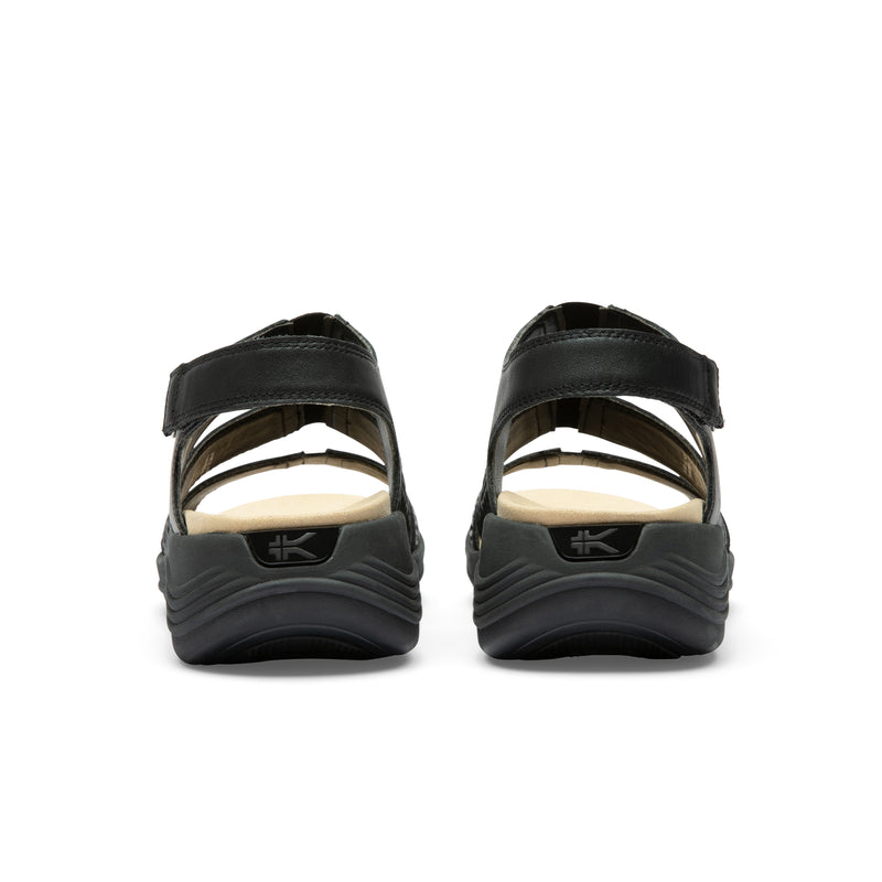 Back heel view of the KURU CODA Muse Women's Sandal in Jet Black-Emboss.