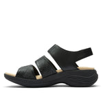 Inner side view of the KURU CODA Muse Women's Sandal in Jet Black-Emboss.