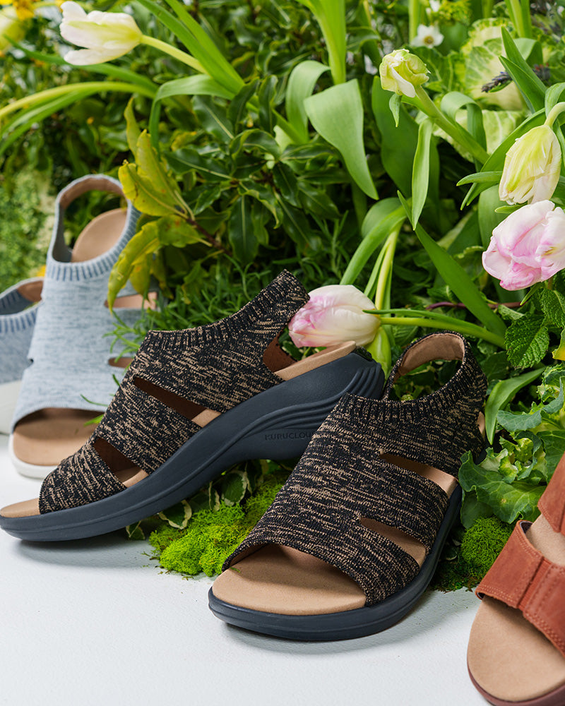 KURU CODA Muse Women's shoes displayed among flowers, ideal for everyday comfort.