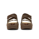 Back heel view of the KURU CODA Muse Women's Sandal in Molasses Brown.