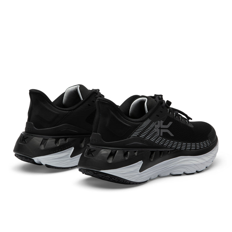 Close-up of the heel cup on the KURU CURA Unisex Shoe in Jet Black-Storm Gray.
