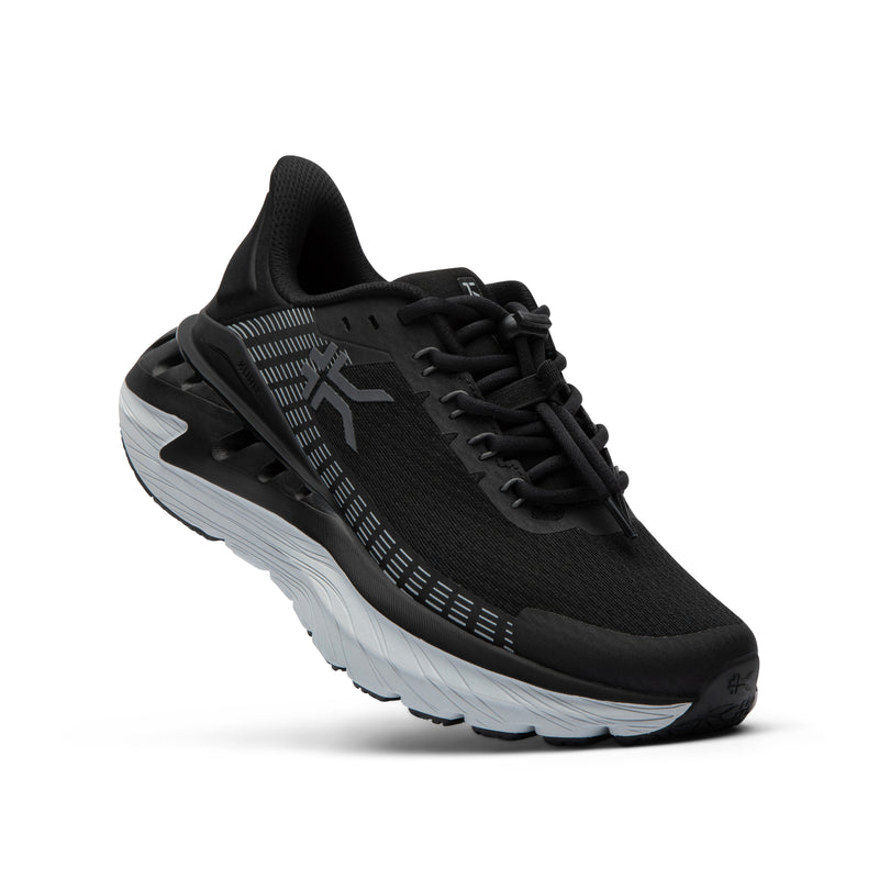 Angled profile view of the KURU CURA Unisex Shoe in Jet Black-Storm Gray.