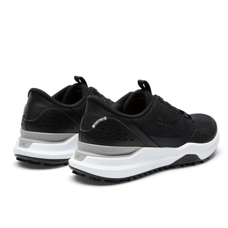 Close-up of the heel cup on the KURU DRIVE Golf Unisex Golf Shoe in Jet Black-Bright White.