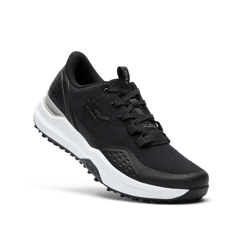 Angled profile view of the KURU DRIVE Golf Unisex Golf Shoe in Jet Black-Bright White.