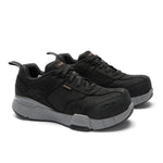 Pair of KURU KOVA Composite Toe Unisex Work Sneaker in Jet Black-Smoke Gray, angled view.