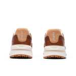 Rear view of the heel and KuruSole on the KURU APOGEE Luxe Unisex Leather Sneaker in Cognac Brown.
