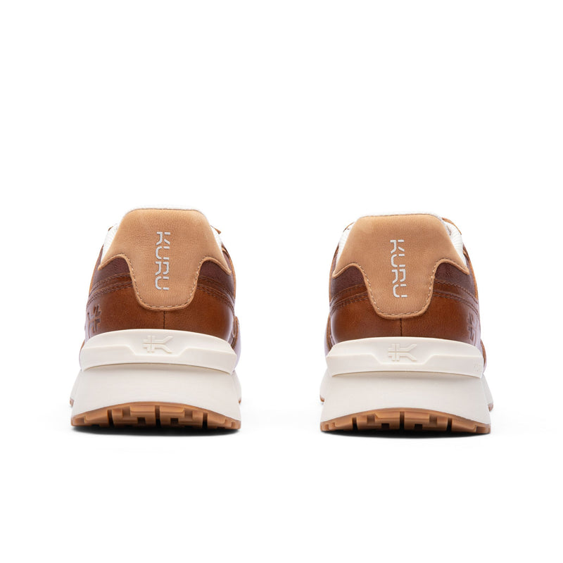 Rear view of the heel and KuruSole on the KURU APOGEE Luxe Unisex Leather Sneaker in Cognac Brown.