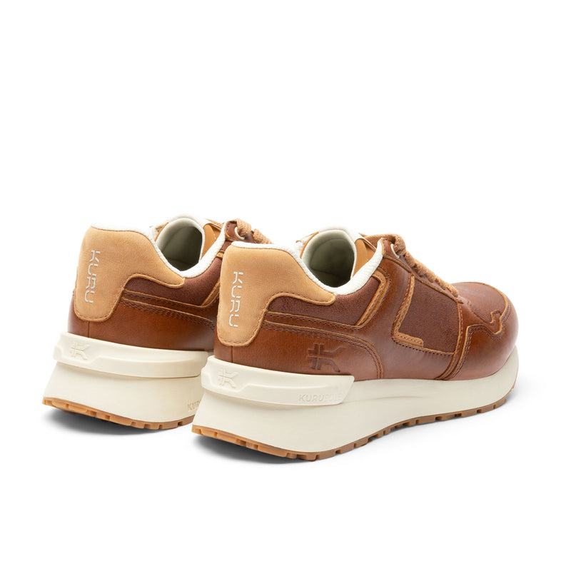 Close-up of the heel cup on the KURU APOGEE Luxe Unisex Leather Sneaker in Cognac Brown-Gum.