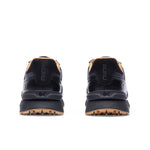 Rear view of the heel and KuruSole on the KURU APOGEE Luxe Unisex Leather Sneaker in Jet Black-Gum.
