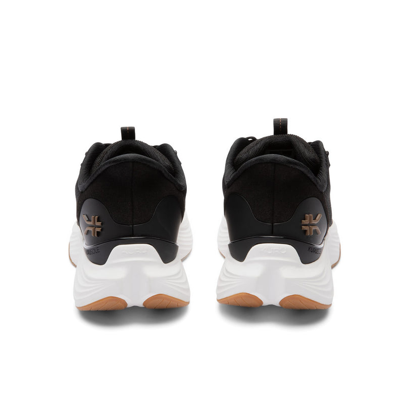 Rear view of the KURU ATOM 2 Men's Athletic Sneaker in Jet Black-Desert Tan showing KURUSOLE heel cup.