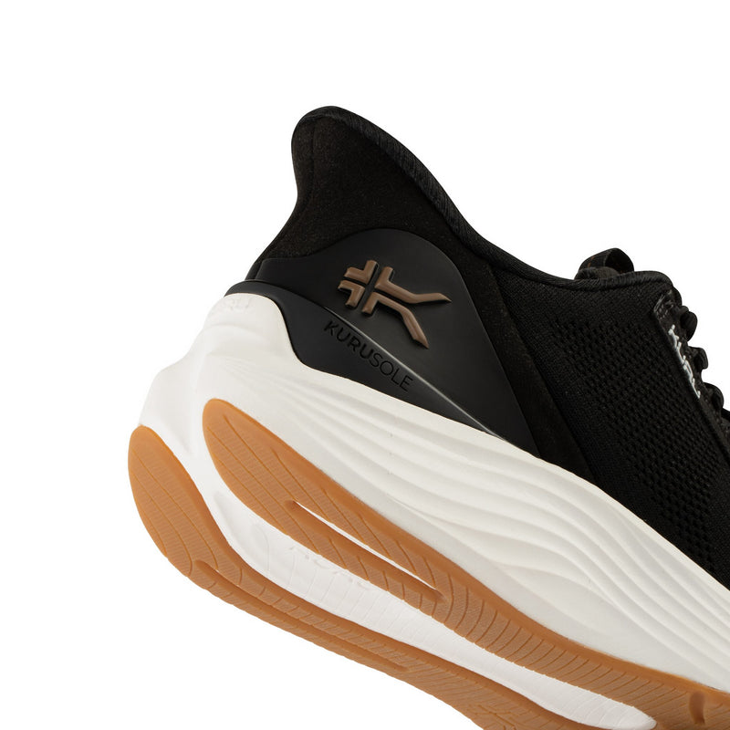 Close-up highlighting KURUSOLE technology on the KURU ATOM 2 Men's Athletic Sneaker in Jet Black-Desert Tan.