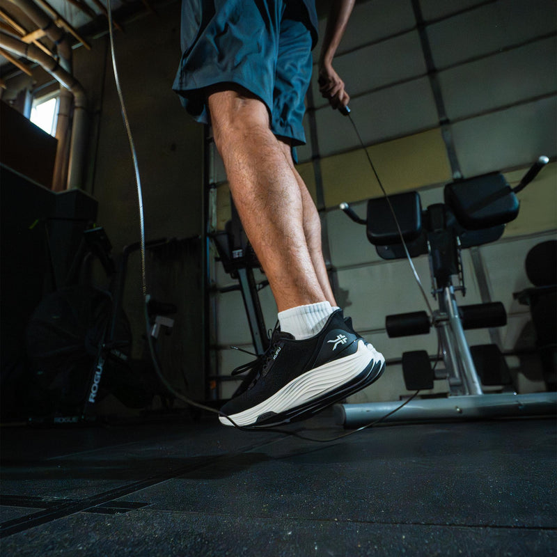 Men's Athletic Sneaker in Jet Black while jumping rope at the gym.