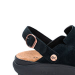 Close-up of the adjustable strap and copper buckle on the KURU MOMENT Ease Women's Sandal in Jet Black.