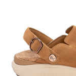 Close-up of the adjustable strap and copper buckle on the KURU MOMENT Ease Women's Sandal in Toffee Brown-Sand.