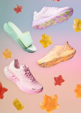 KURU women's shoes in pastel colorways floating in a candy-themed scene, featuring slides, sneakers, and runners.