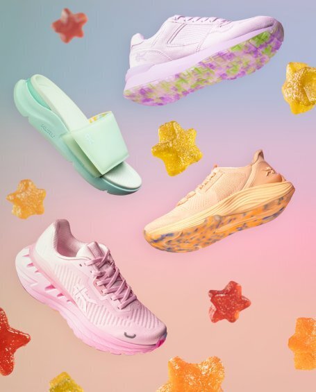 KURU Women's sneakers and sandals in pastel candy colors, floating with gummy star candies.