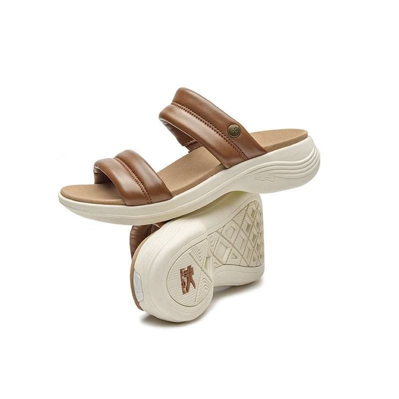 Close-up of the heel cup on the KURU CODA Mesa Women's Sandal in Amber Brown-Pearl White.