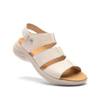 Angled profile view of the KURU CODA Muse Women's Sandal in Shell-Sand.