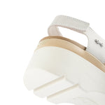 Pair of KURU LOMA Women's Sandal in Ecru-Sand, angled view.