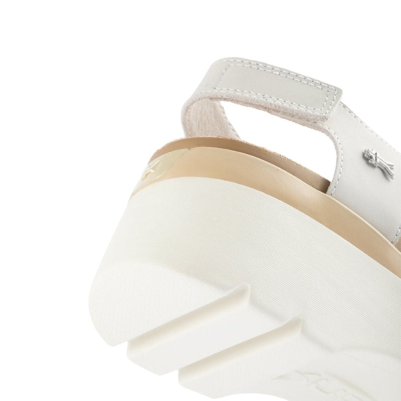 Pair of KURU LOMA Women's Sandal in Ecru-Sand, angled view.