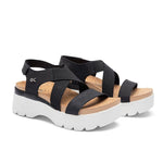Pair of KURU LOMA Women's Sandal in Jet Black-Bright White, angled view.
