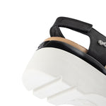 Pair of KURU LOMA Women's Sandal in Jet Black-Bright White, angled view.