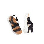 Close-up of the heel cup on the KURU LOMA Women's Sandal in Jet Black-Bright White.
