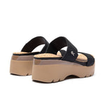 Angled profile view of the KURU LOMA Tila Women's Sandal in Jet Black-Sand.