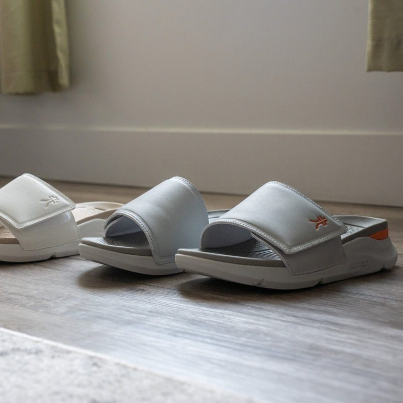 Person wearing the KURU MOMENT Women's Sandal.