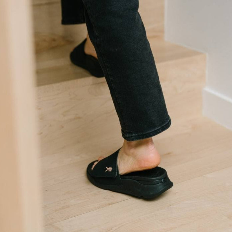 Person wearing the KURU MOMENT Women's Sandal.