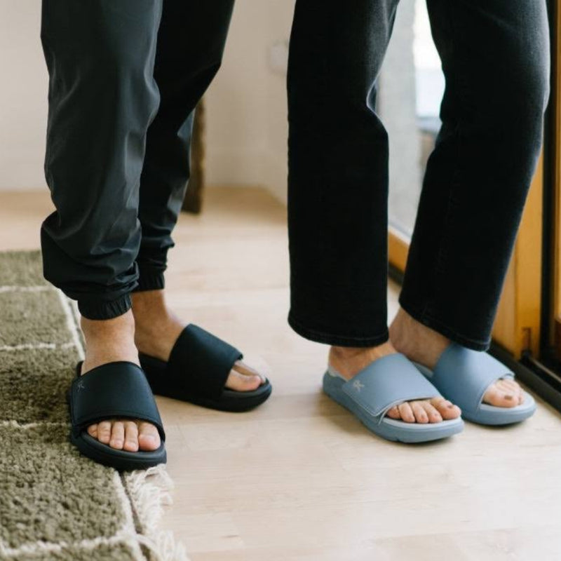 Person wearing the KURU MOMENT Women's Sandal.
