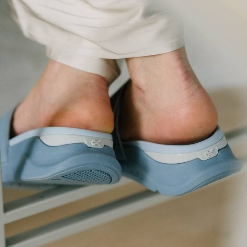 Person wearing the KURU MOMENT Women's Sandal.