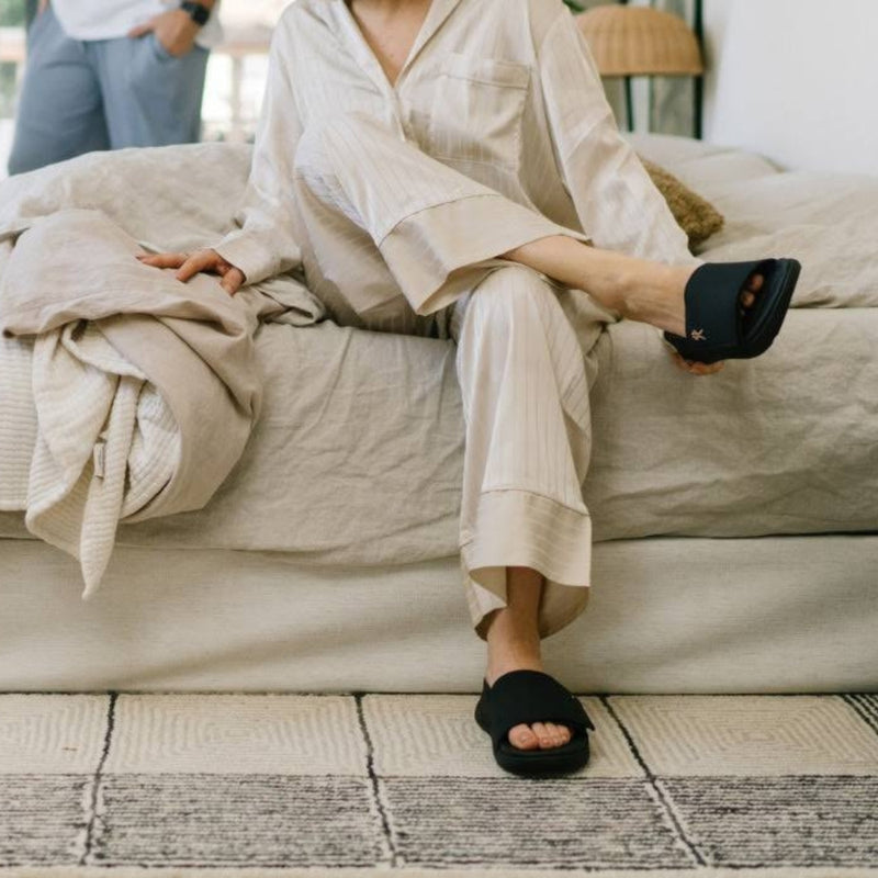 Person wearing the KURU MOMENT Women's Sandal.