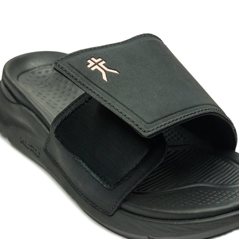 Close-up of the heel cup on the KURU MOMENT Women's Sandal in Jet Black-Peach Sherbet.