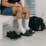 Person wearing the KURU MOMENT Men's Sandal.