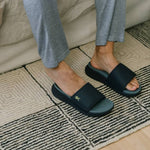 Back heel view of the KURU MOMENT Men's Sandal in Jet Black-Storm Gray.