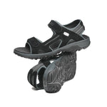 Pair of KURU TREAD Men's Sandal in Jet Black-Empire Steel, angled view.