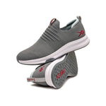 Pair of KURU ATOM Slip-On Men's Slip-On Sneaker in Cloud Gray-Cardinal Red, angled view.