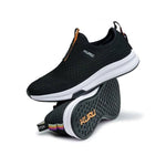 Pair of KURU ATOM Slip-On Women's Slip-On Sneaker in Jet Black, angled view.